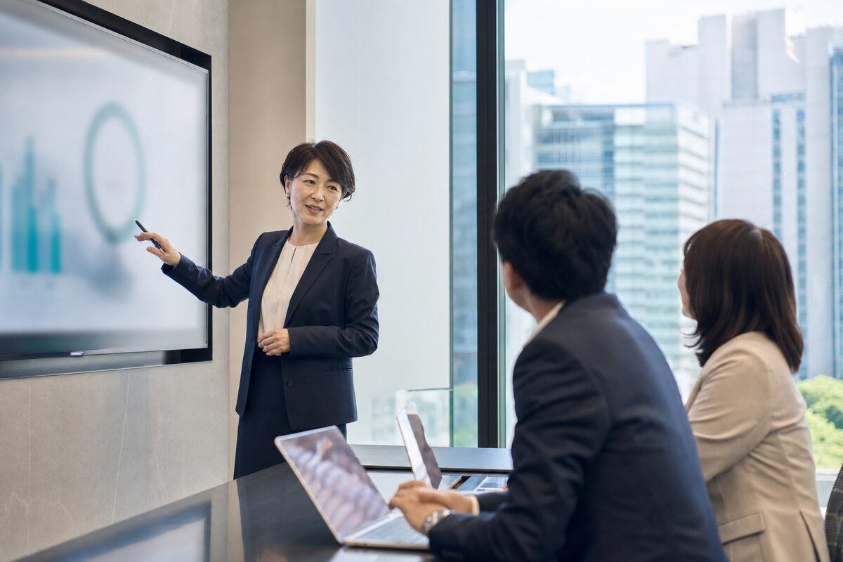 A senior finance leader presenting results to colleagues