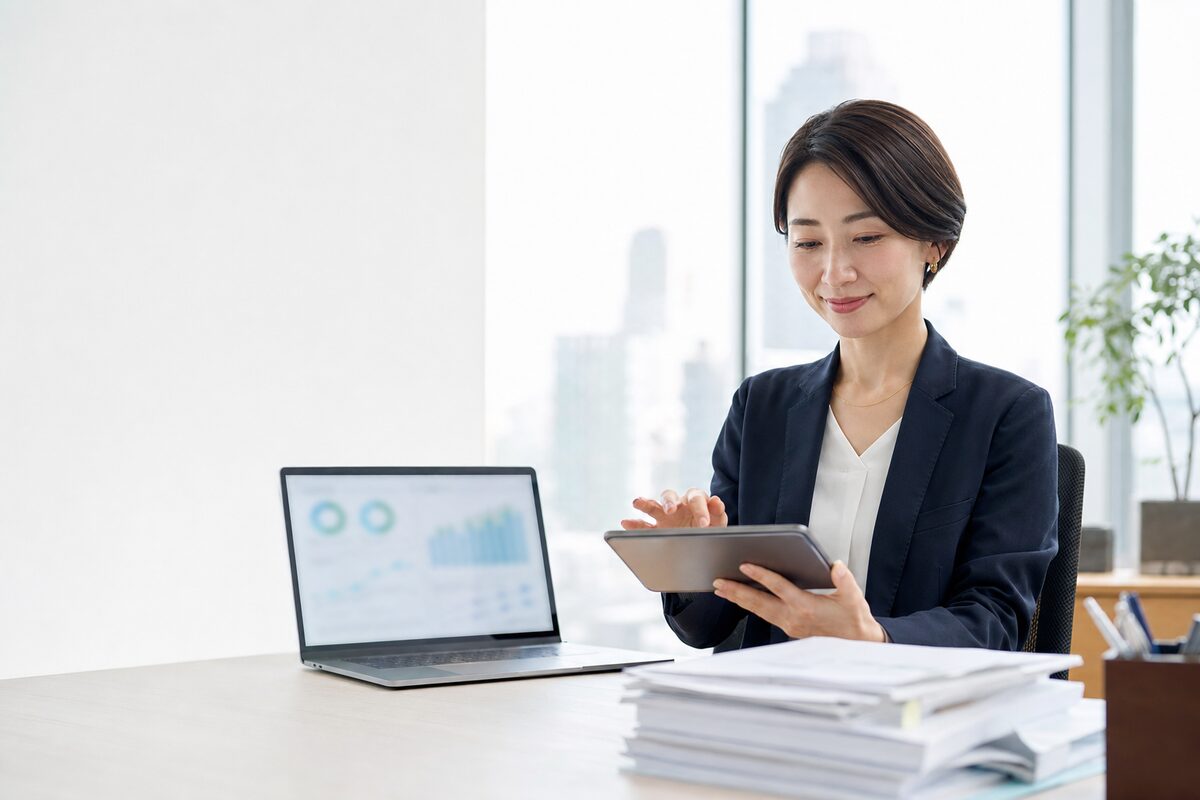 A finance professional approving payments on a tablet